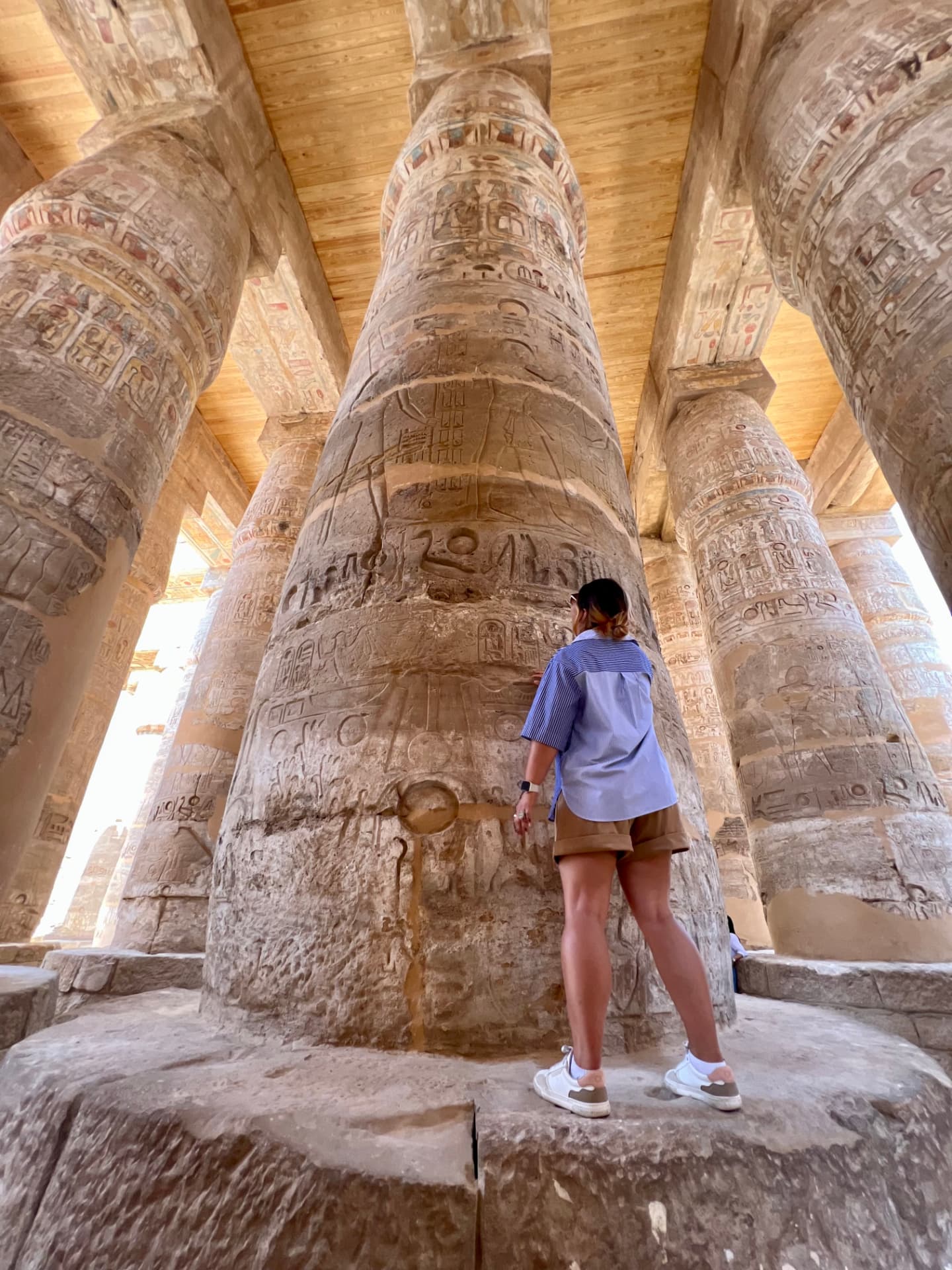 Standing among monumental carved stone columns